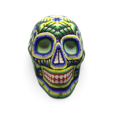 Huichol beaded skull in cool green, blue and yellow seed beads with intricate patterns, front view