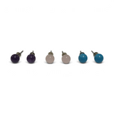 Rare Earth Gallery 6mm round gemstone stud earrings in purple, pale pink, and bright blue on a white background