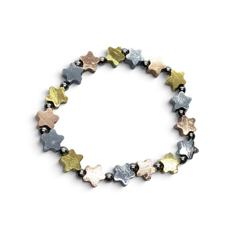 Rare Earth Gallery Muonionalusta meteorite star bracelet with rose gold, gold, and sterling silver bead spacers.
