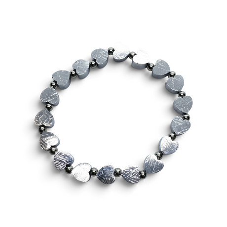 Rare Earth Gallery heart-shaped Muonionalusta meteorite bracelet with polished 925 sterling silver bead spacers.