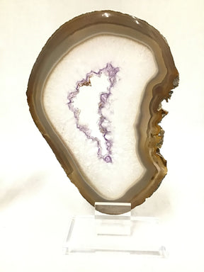 Amethyst and carnelian agate slice displayed on a clear acrylic screw stand, showcasing natural patterns and colors.