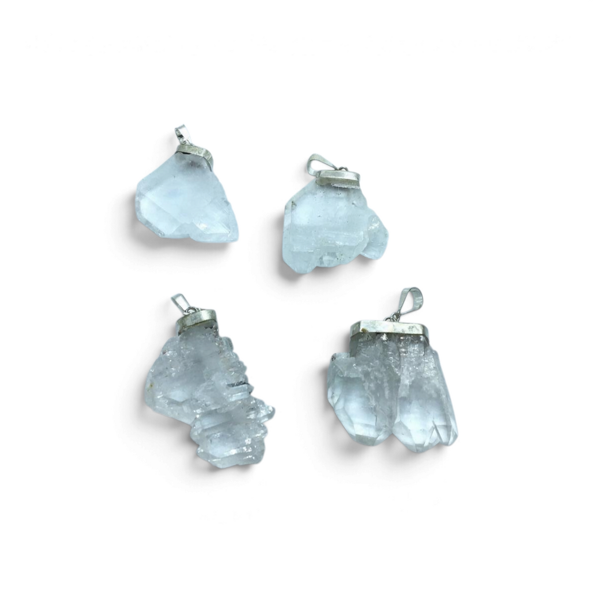 Rare Earth Gallery Faden Quartz pendant collection featuring four unique raw crystal clusters with silver bails.