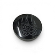 Small glossy black obsidian cabochon etched with a wolf paw print filled with Celtic knotwork symbols