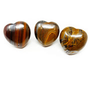 Three polished Tiger Iron hearts from Africa with gold, red and steely gray banding