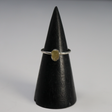 Rough freeform Egyptian tektite in a silver bezel on a thin band, shown on a black cone stand