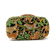 Safari Jungle Crystal Purse with Chain closed front view, giraffe, leopard and lion in gold crystal amid green leaves