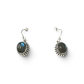 Rare Earth Gallery oval labradorite dangle earrings featuring a raised silver bezel with intricate beaded detailing.