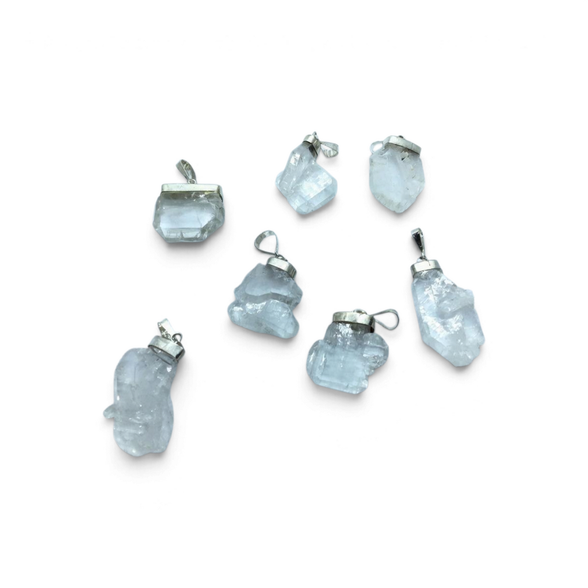 Rare Earth Gallery Faden Quartz small cluster pendants with silver bails on a white background