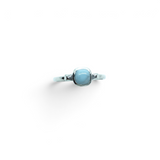Rare Earth Gallery square larimar cabochon ring featuring a polished silver bezel and a studded band design.