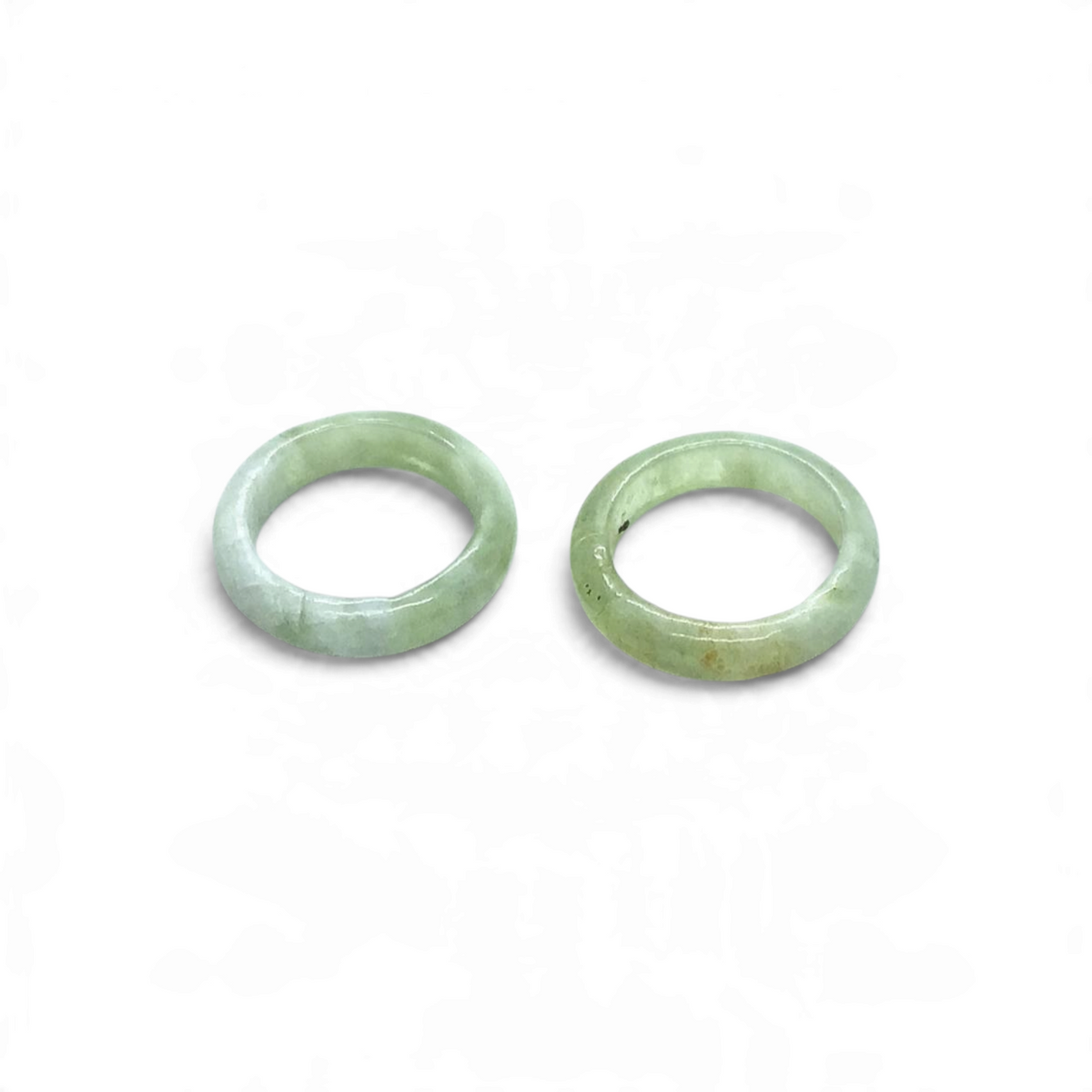 Rare Earth Gallery New Jade serpentine gemstone rings in a smooth band style with pale green translucent tones.