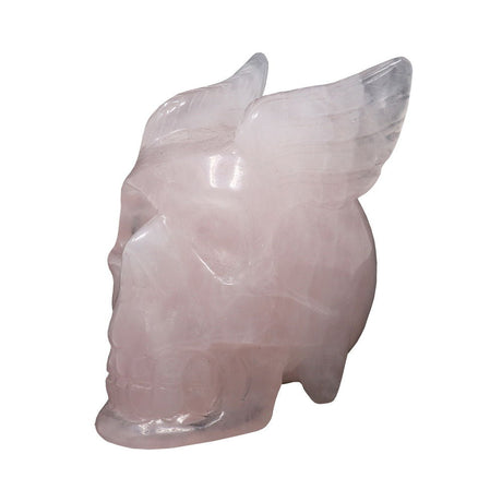 Rose quartz skull with wings carving, angled side view showing carved feathered wings