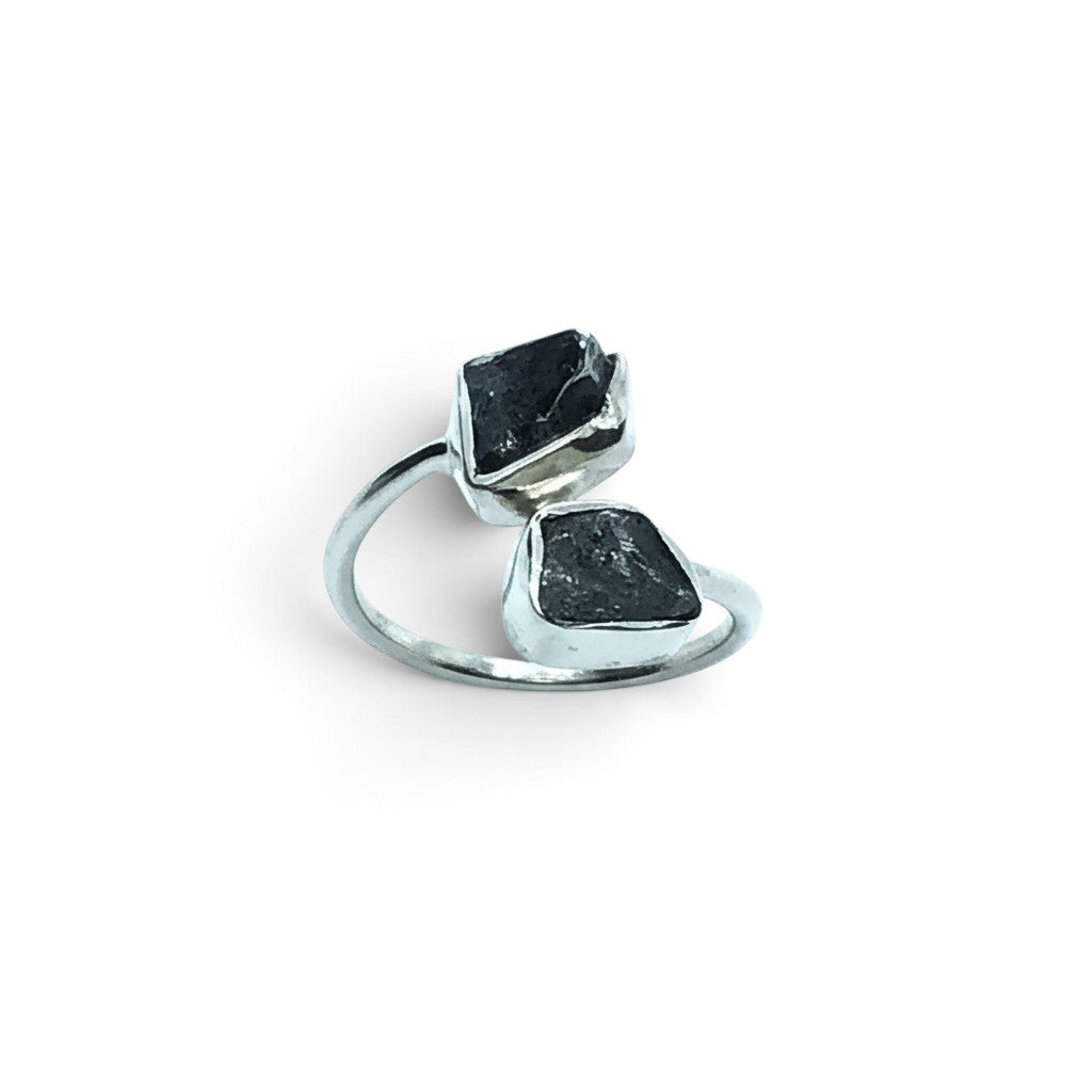 Rare Earth Gallery Agoudal meteorite ring featuring two raw black nuggets in a polished silver open band setting.