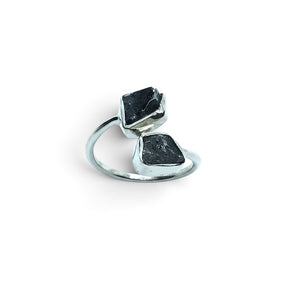 Rare Earth Gallery Agoudal meteorite ring featuring two raw black nuggets in a polished silver open band setting.