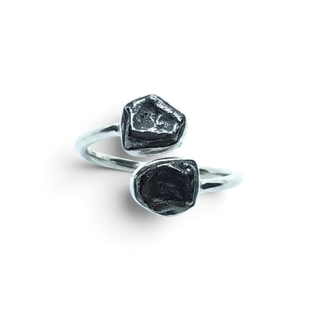 Rare Earth Gallery Agoudal meteorite ring with two dark, textured nuggets in a polished silver open band setting.