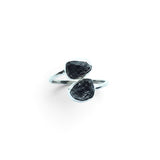 Rare Earth Gallery Agoudal meteorite ring featuring two raw black meteorite nuggets in a silver bezel set open band.