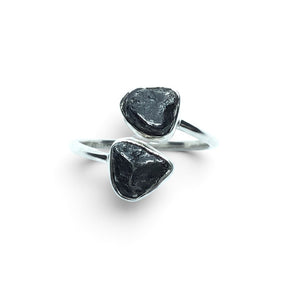 Rare Earth Gallery Agoudal meteorite ring featuring two bezel-set cosmic nuggets on a polished silver open band.