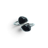 Rare Earth Gallery Agoudal meteorite ring featuring two raw black meteorite nuggets in a polished silver open band