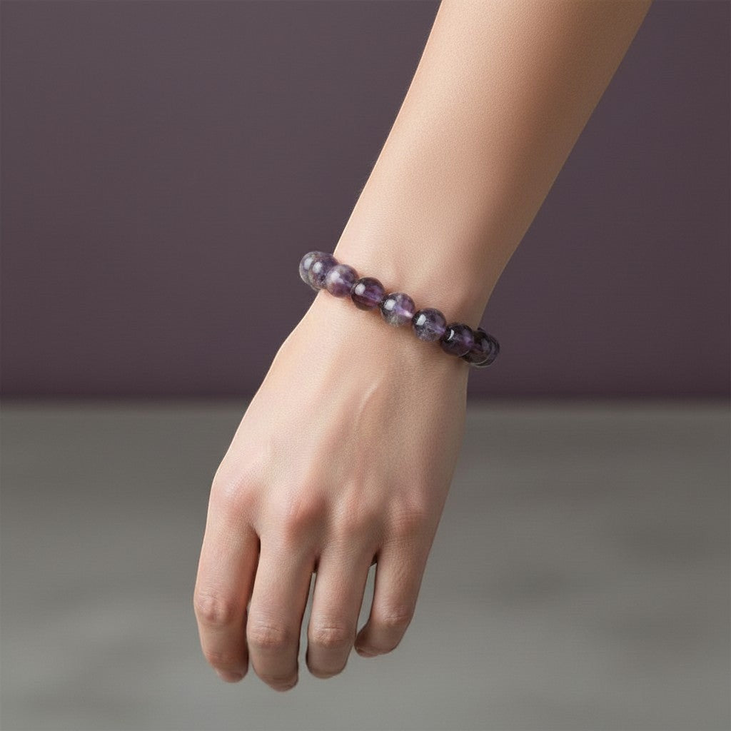 Rare Earth Gallery Ametrine beaded bracelet with 13.5-14.5 mm round purple and yellow beads on a wrist.
