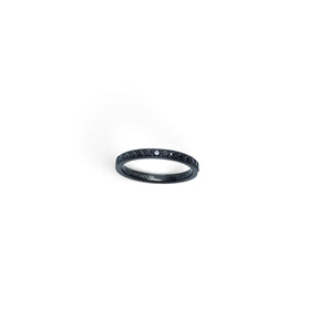 Rare Earth Gallery 2mm titanium ring with black IP plating and a half-band of sparkling black cubic zirconia stones.