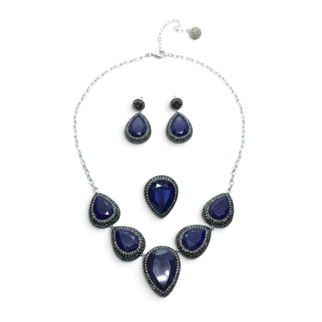 Rare Earth Gallery blue sapphire jewelry set with pear-cut stones, marcasite, and silver crystals on a white background