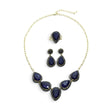 Rare Earth Gallery blue sapphire necklace, pear-shaped earring set, and double band ring with gold overlay and marcasite