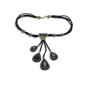 Rare Earth Gallery blue sapphire necklace with four faceted pear pendants, gold Swarovski crystals, and marcasite.