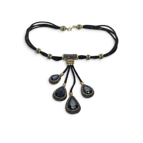 Rare Earth Gallery blue sapphire necklace with four faceted pear pendants, gold Swarovski crystals, and marcasite.