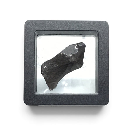 Rare Earth Gallery tumbled Canyon Diablo iron meteorite specimen displayed in a protective black floating gel box.