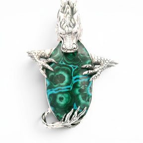 Rare Earth Gallery dragon pendant featuring a green and blue chrysocolla malachite stone set in detailed silver.