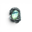 Rare Earth Gallery oval labradorite ring featuring yellow and teal iridescence set in an ornate silver dragon band.