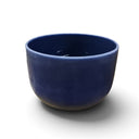 Rare Earth Gallery 10-inch lapis lazuli gem infused quartz singing bowl in deep blue, tuned to note A at 440 Hertz.