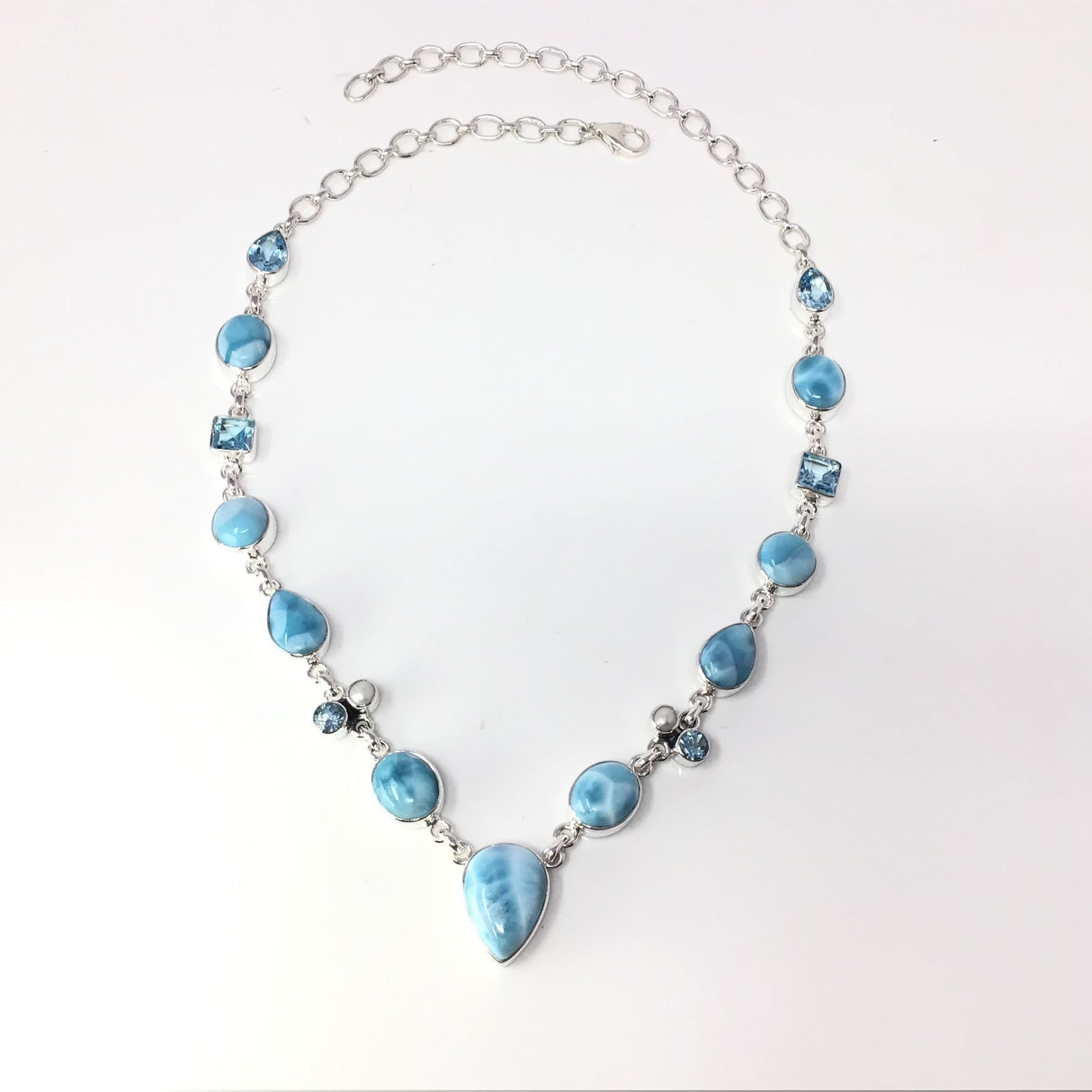 Rare Earth Gallery Larimar link necklace with faceted blue topaz and pearl accents, featuring a pear-shaped larimar pendant.