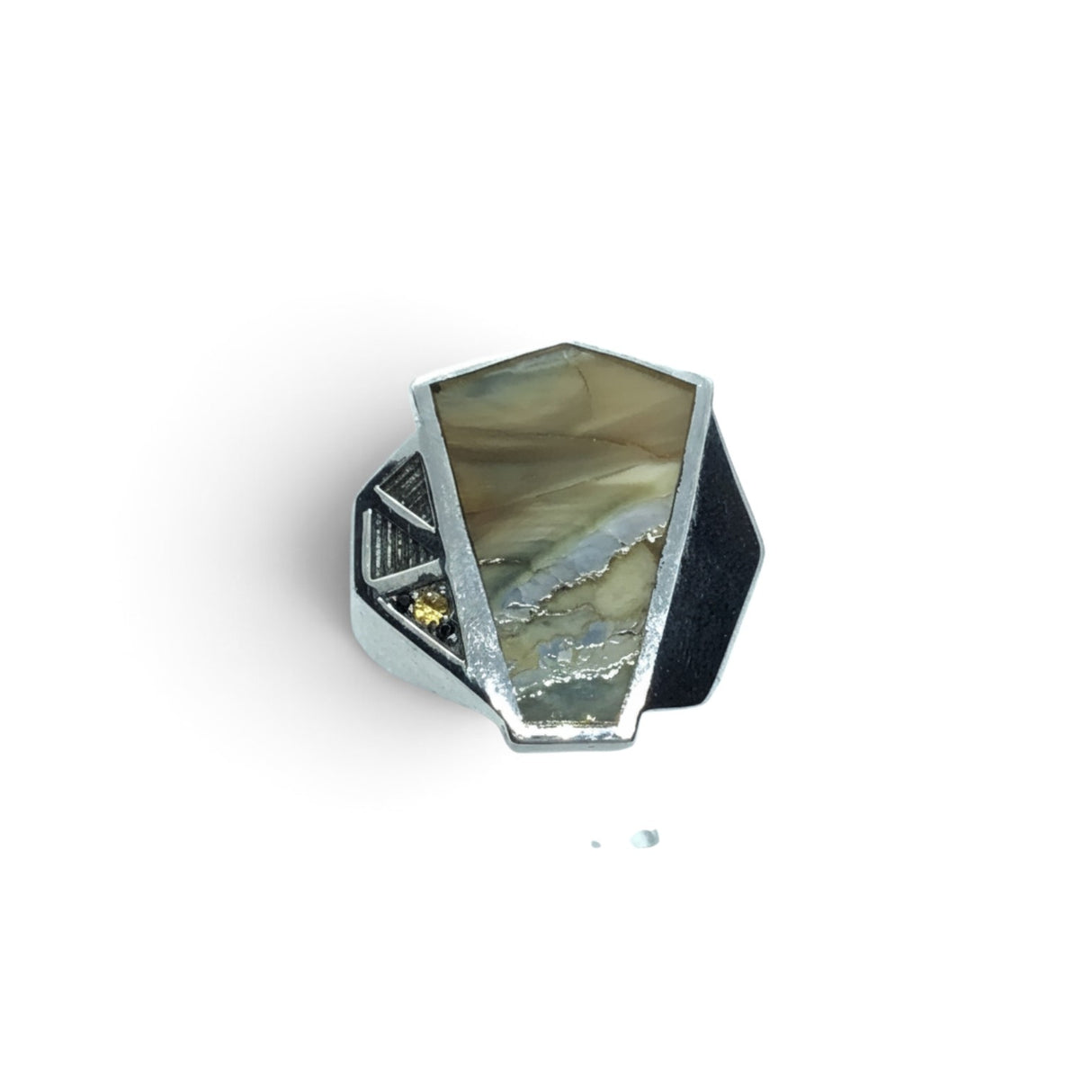 Rare Earth Gallery wooly mammoth tooth fossil ring featuring yellow sapphires set in a geometric silver band.