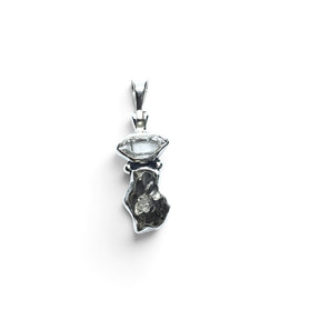 Rare Earth Gallery Campo De Cielo meteorite nugget pendant with a Herkimer diamond set in 925 sterling silver.