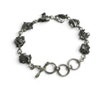 Rare Earth Gallery Campo De Cielo meteorite link bracelet featuring eight raw iron freeform stones and a toggle clasp.