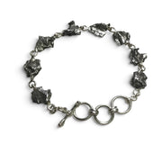Rare Earth Gallery Campo De Cielo meteorite link bracelet featuring eight raw iron freeform stones and a toggle clasp.