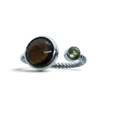Rare Earth Gallery Sericho pallasite meteorite and faceted moldavite ring on a sterling silver open rope band.