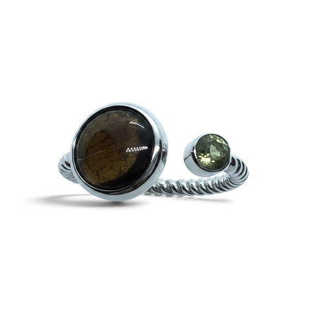 Rare Earth Gallery Sericho pallasite meteorite and faceted moldavite ring on a sterling silver open rope band.