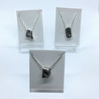 Rare Earth Gallery Campo De Cielo meteorite necklaces in freeform silver bezels on delicate silver box chains.