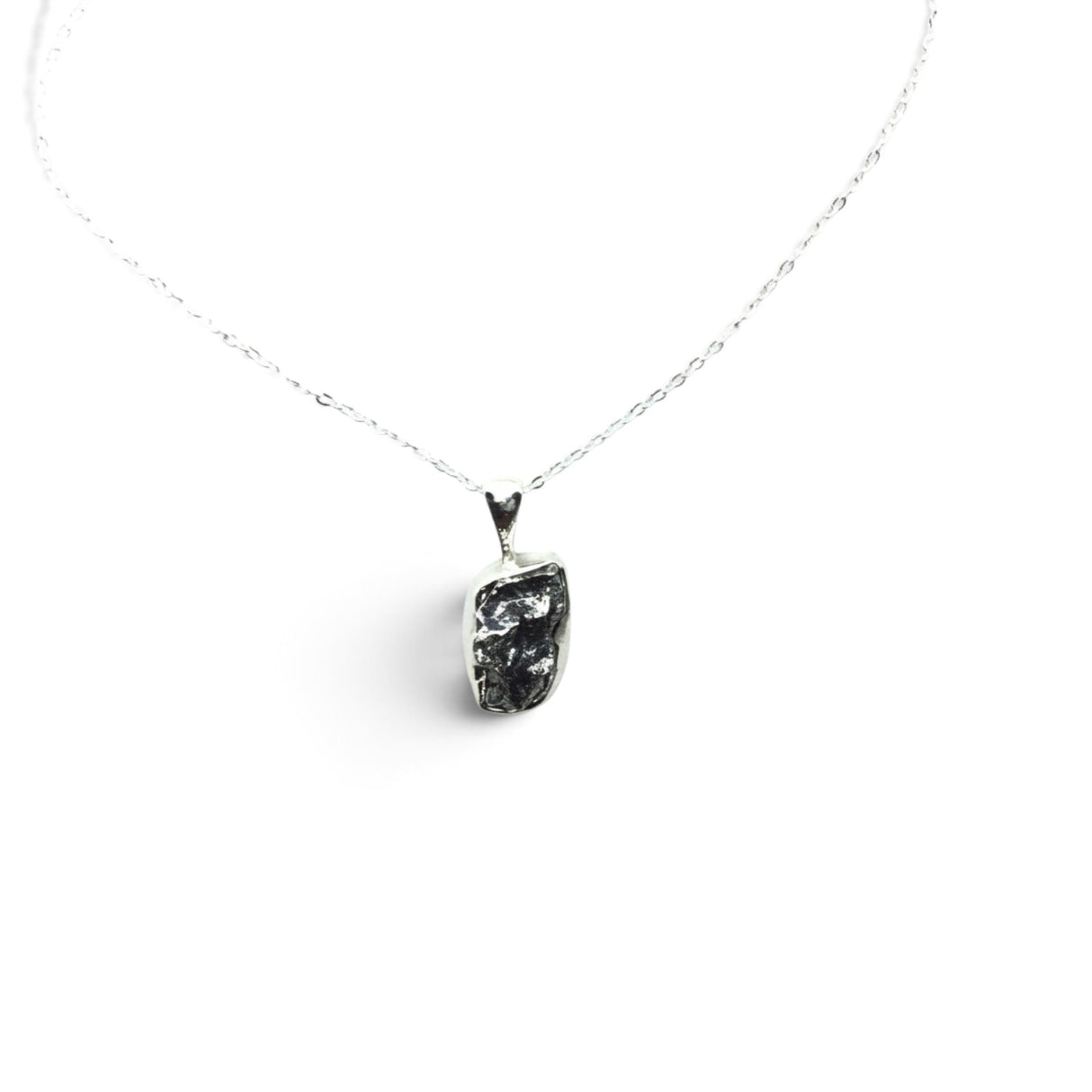 Rare Earth Gallery Campo De Cielo meteorite nugget pendant in a 925 sterling silver bezel on an 18-inch chain