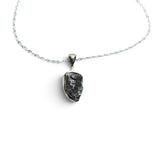 Rare Earth Gallery Campo De Cielo meteorite nugget pendant in a 925 sterling silver bezel on an 18-inch chain