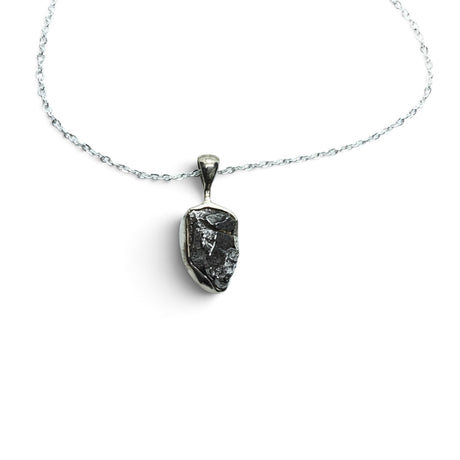 Rare Earth Gallery Campo De Cielo meteorite nugget pendant in a 925 sterling silver bezel on an 18-inch chain