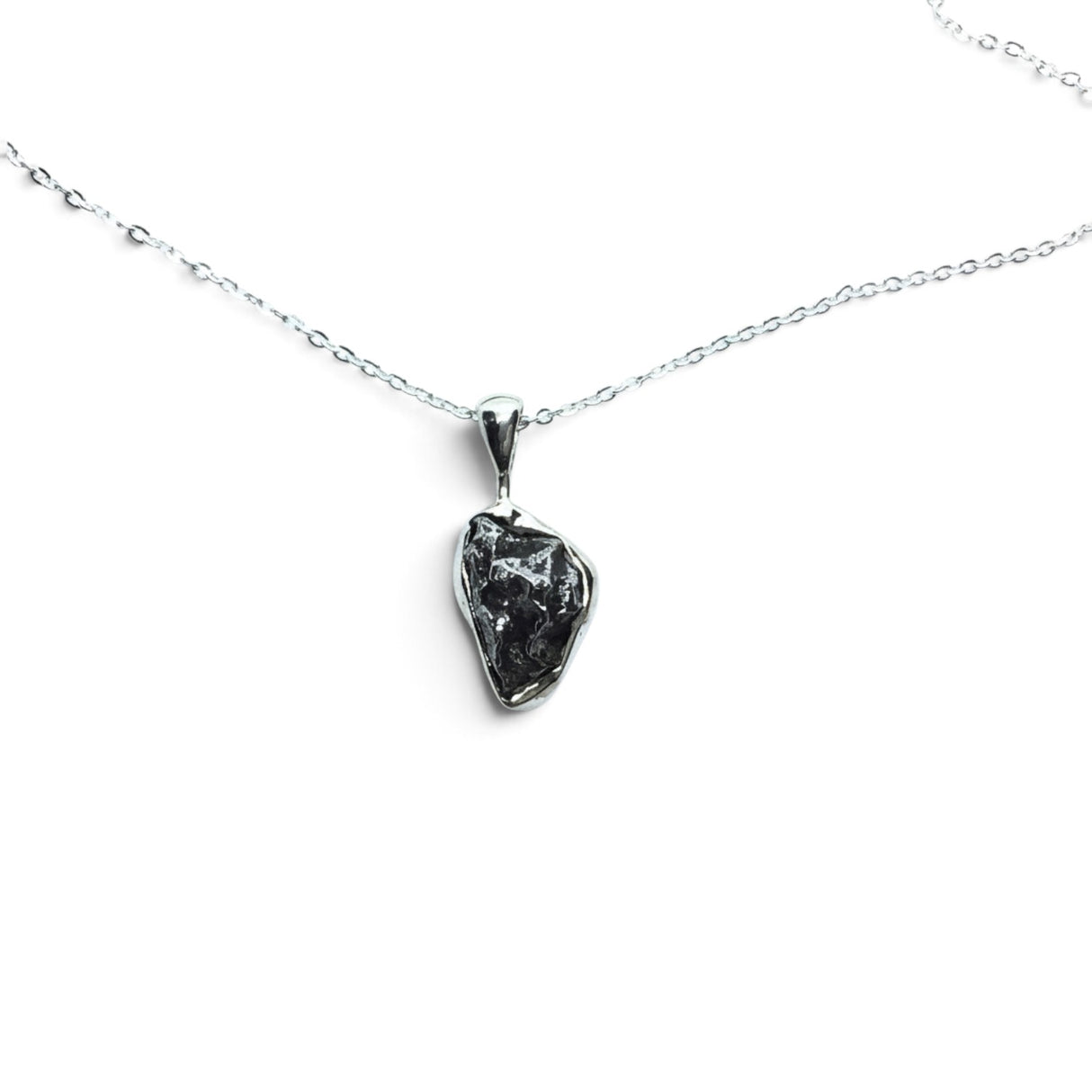 Rare Earth Gallery Campo De Cielo meteorite nugget pendant in a 925 sterling silver bezel on an 18-inch chain