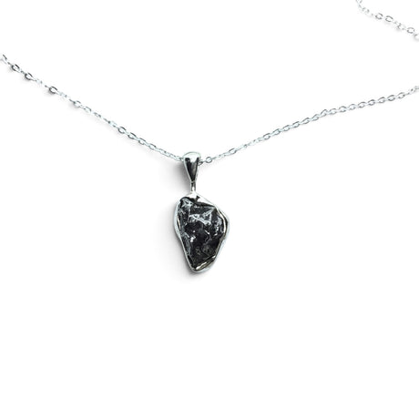 Rare Earth Gallery Campo De Cielo meteorite nugget pendant in a 925 sterling silver bezel on an 18-inch chain