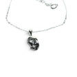 Rare Earth Gallery Campo De Cielo meteorite nugget pendant in a 925 sterling silver bezel on an 18-inch chain.
