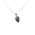 Rare Earth Gallery Campo De Cielo meteorite nugget pendant in a 925 sterling silver bezel on an 18-inch chain