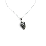 Rare Earth Gallery Campo De Cielo meteorite nugget pendant in a 925 sterling silver bezel on an 18-inch chain