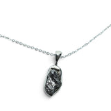 Rare Earth Gallery Campo De Cielo meteorite nugget pendant in a 925 sterling silver bezel on an 18-inch chain