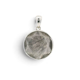 Rare Earth Gallery Muonionalusta meteorite pendant with 6-pointed star pattern in a rhodium-plated sterling silver case