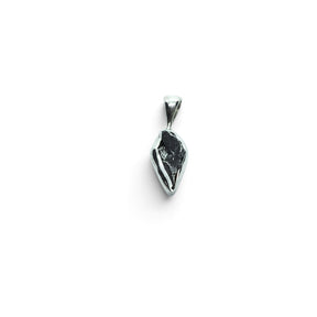 Rare Earth Gallery Campo De Cielo meteorite pendant featuring an organic nugget shape in a 925 sterling silver bezel